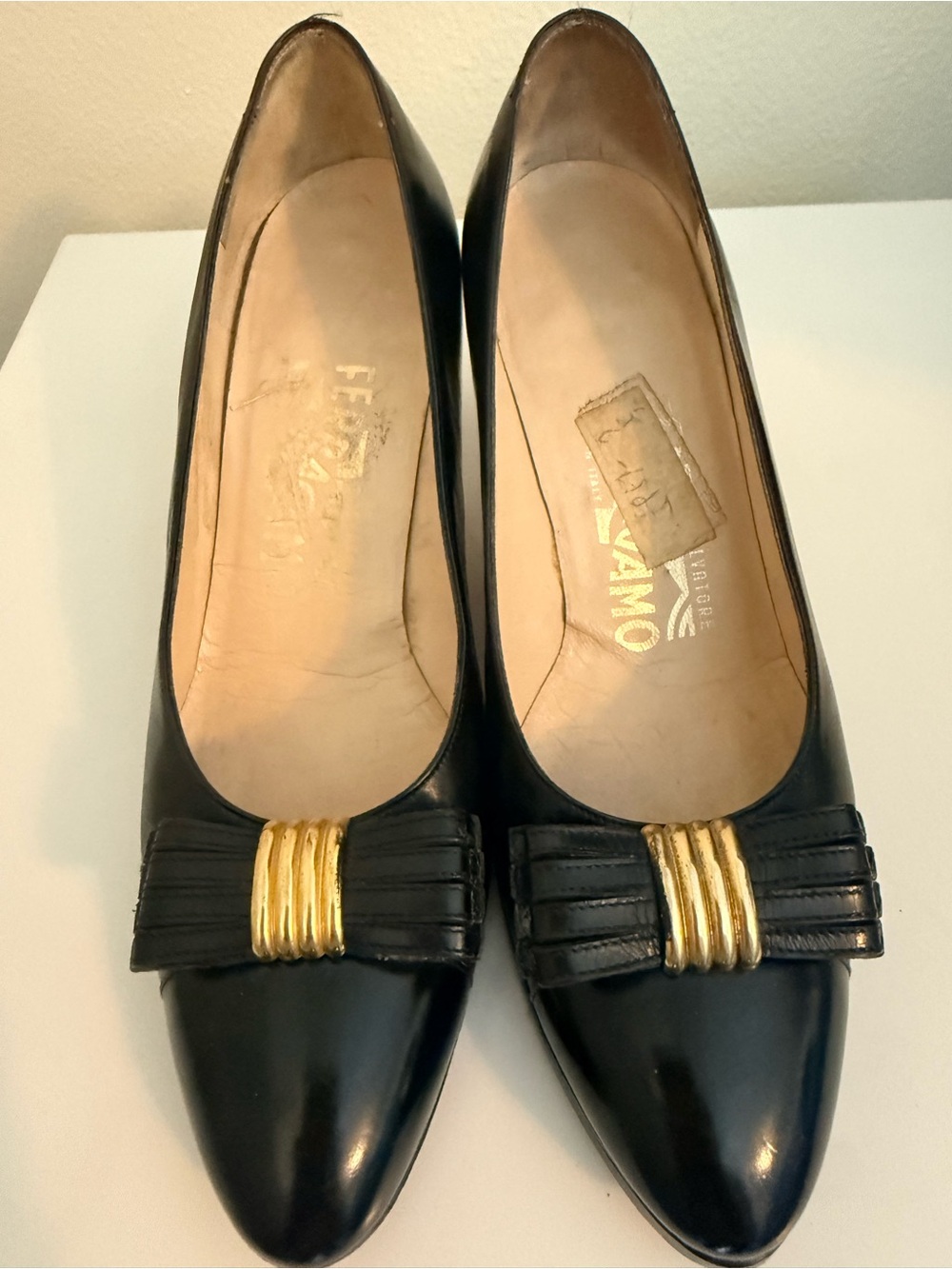 Salvatore Ferragamo Black Leather Pointed-Toe Pumps with Gold Bow Accent
